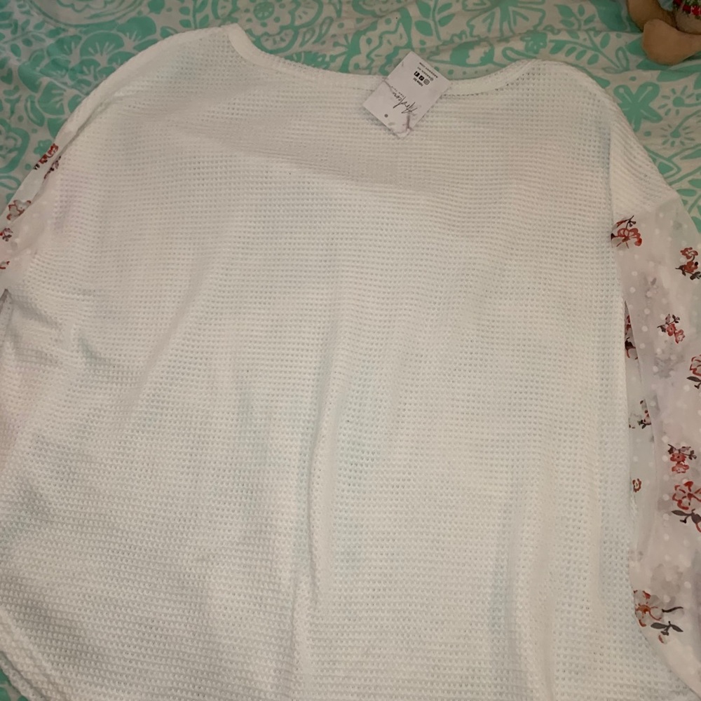 Oversized sweater with floral mesh sleeves